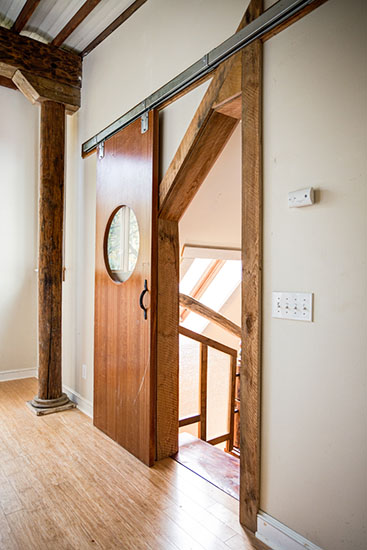 The bedroom door is an old-timey restaurant swinging door that we put on hardware meant for a barn door. The handle was a horseshoe.